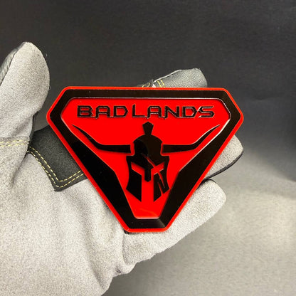 Badlands Gladiator car badge with Spartan warrior helmet design for off-road truck and SUV.