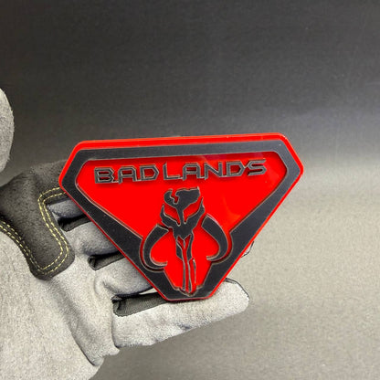 Premium Badlands Mythosaur-inspired vehicle badge with detailed skull artwork, suitable for custom Dodge, RAM, Ford and Jeep automotive styling.