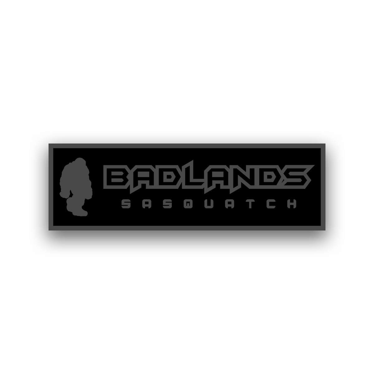 Badlands Sasquatch engraving fender badge with bold lettering and Bigfoot design