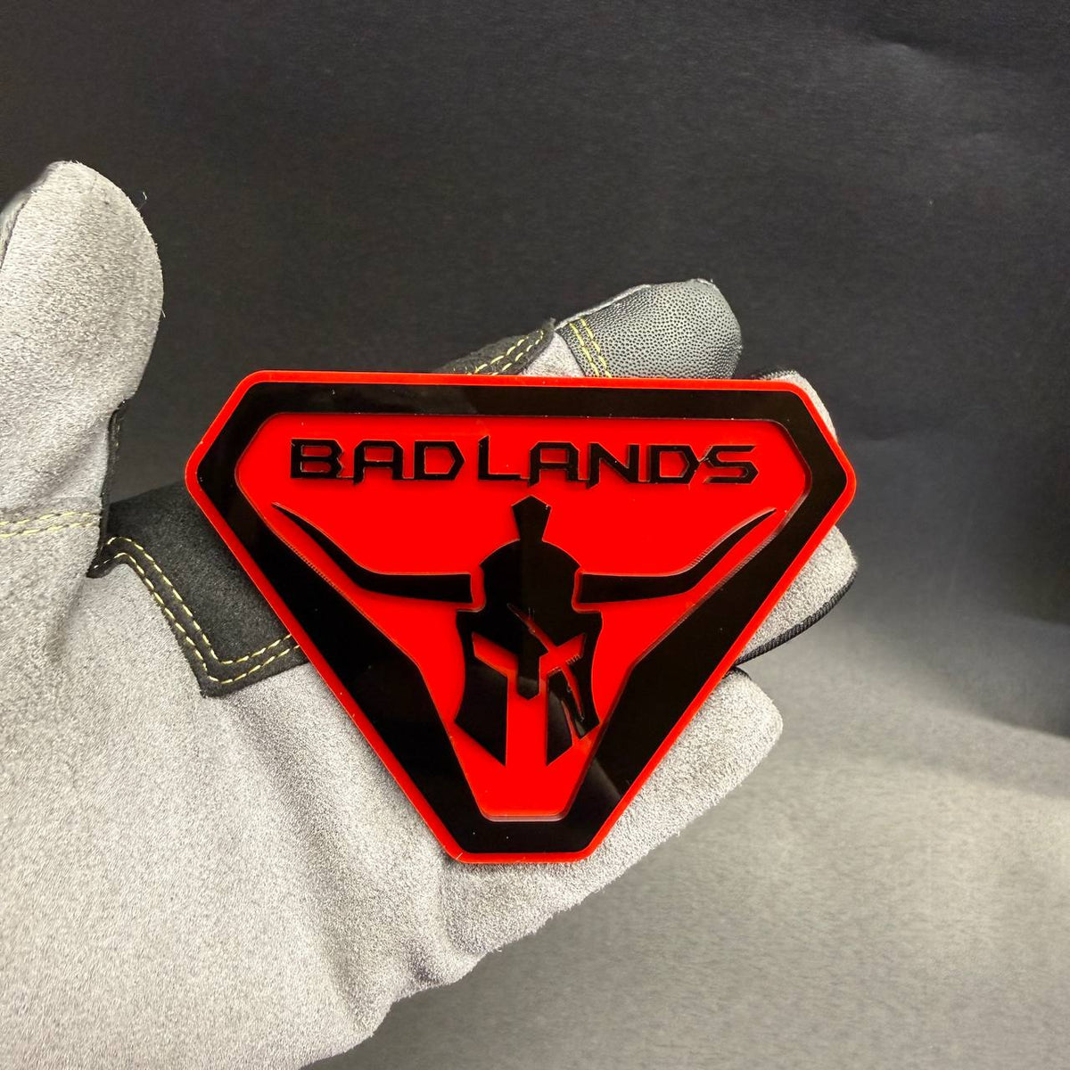 Custom Badlands Spartan Gladiator car emblem for truck fender and off-road 4x4 styling.
