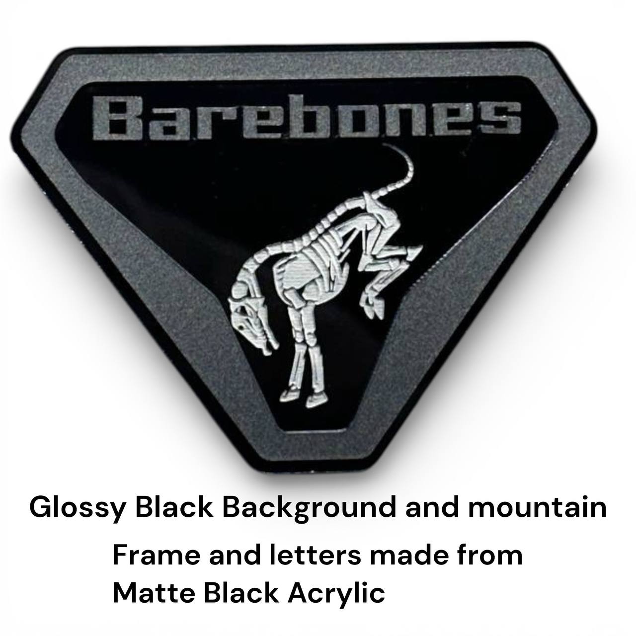 Close up of Barebones skeleton emblem for Ford Bronco showing laser cut acrylic details