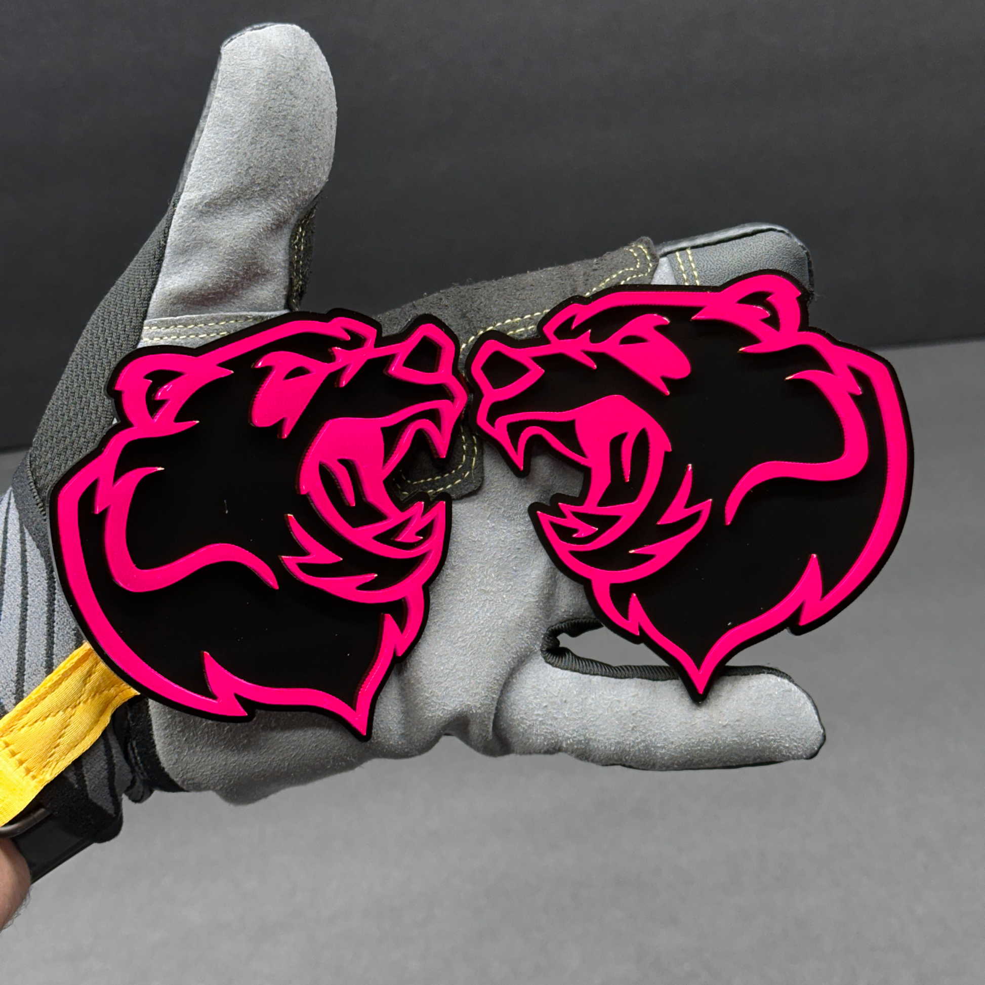 Bear head badge pair shown as custom vehicle fender emblem for automotive use