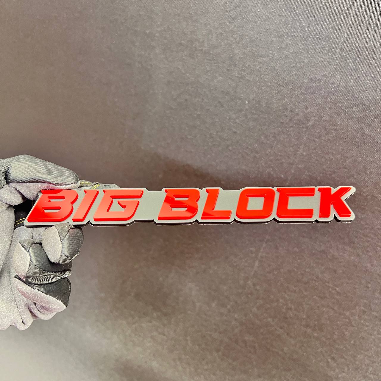 BIG BLOCK performance engine car emblem with bold red lettering and silver background