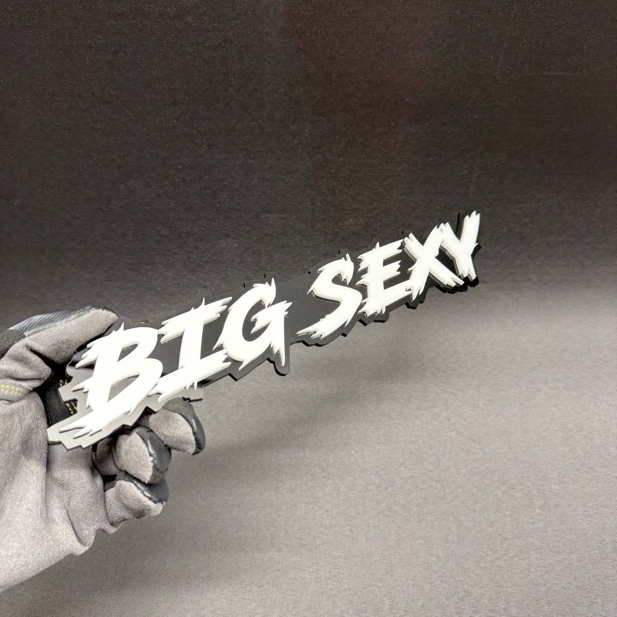 Big Sexy personalized truck tailgate badge featuring bold white text on black acrylic, suitable for GMC Sierra, Chevrolet Silverado and Toyota Tundra.