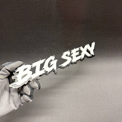 Big Sexy personalized truck tailgate badge featuring bold white text on black acrylic, suitable for GMC Sierra, Chevrolet Silverado and Toyota Tundra.