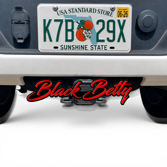 Black Betty hitch cover mounted on truck receiver with rugged offroad style