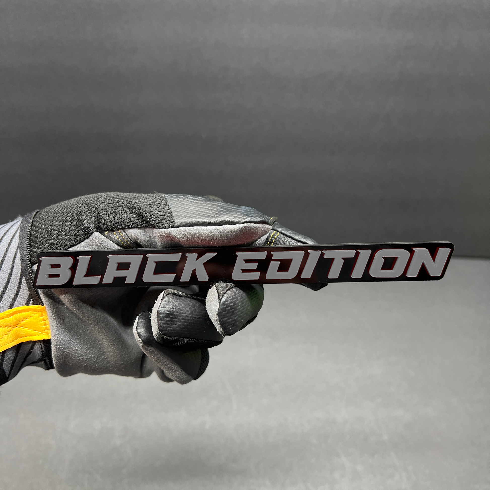 Premium Black Edition car emblem designed for fender or tailgate mounting.