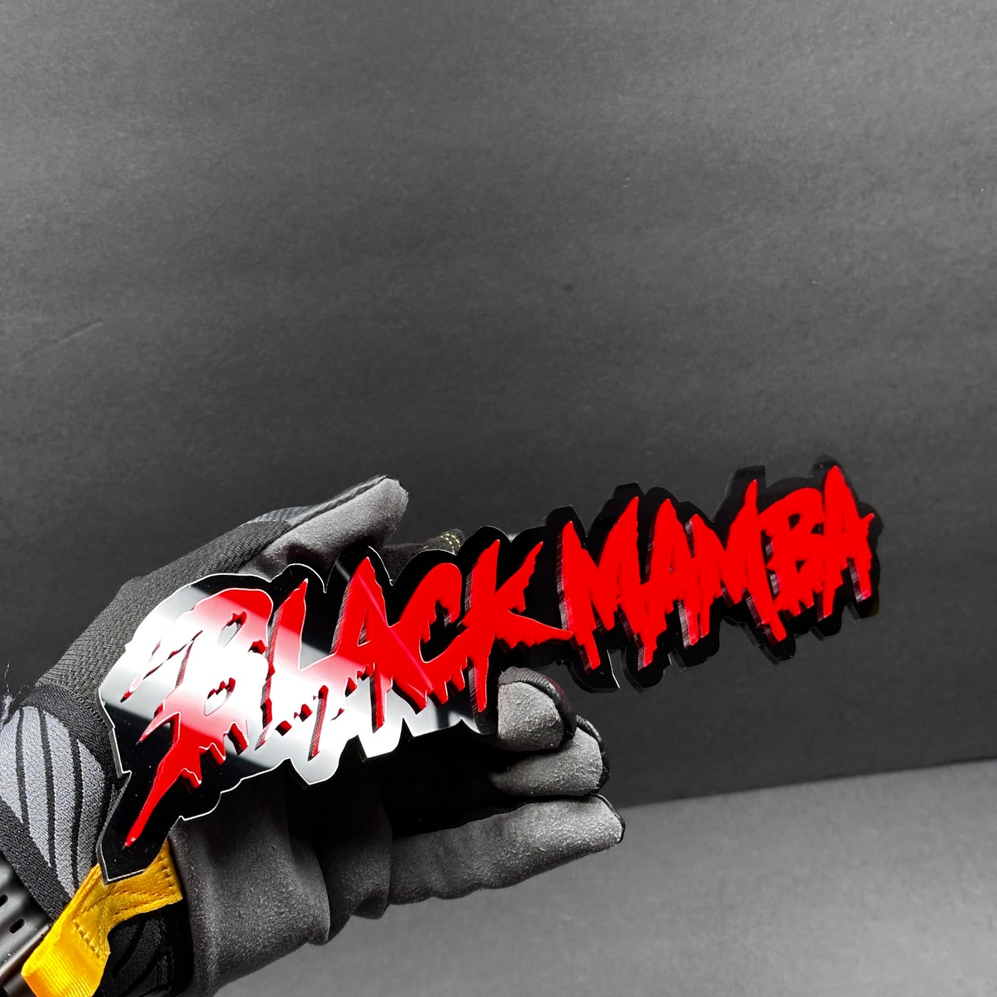 Custom Black Mamba racing script emblem with layered acrylic automotive finish