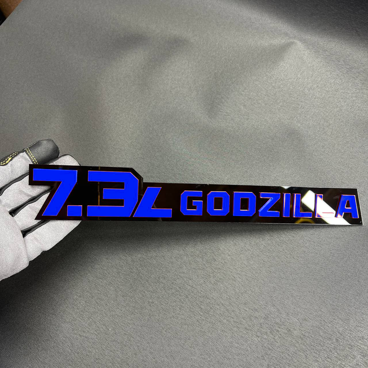 7.3L Godzilla acrylic fender badge in pink and black for Ford Super Duty truck customization.