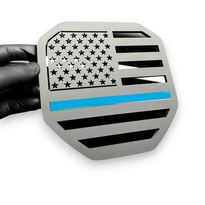 Black red line flag badge on Dodge Ram heavy duty truck styling