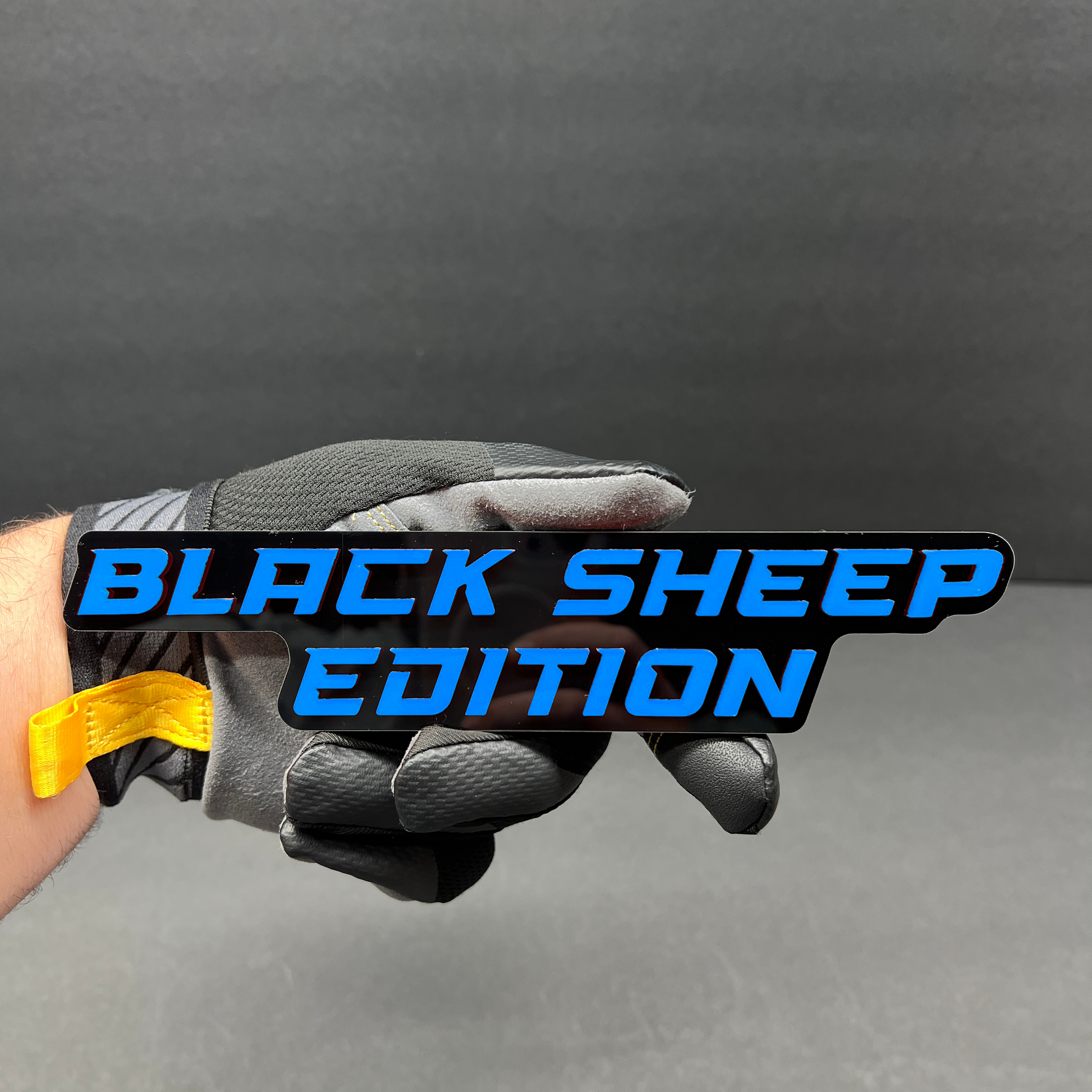 Black Sheep Edition acrylic text badge for automotive enthusiasts.
