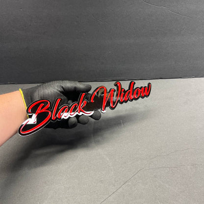 Front view of Black Widow custom acrylic car badge with red and black layered design spider