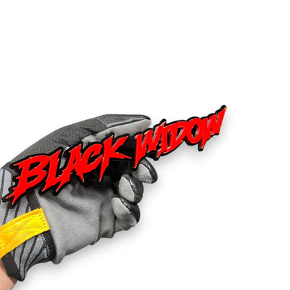 Close-up of Black Widow 3D acrylic racing emblem showing sharp drip lettering details