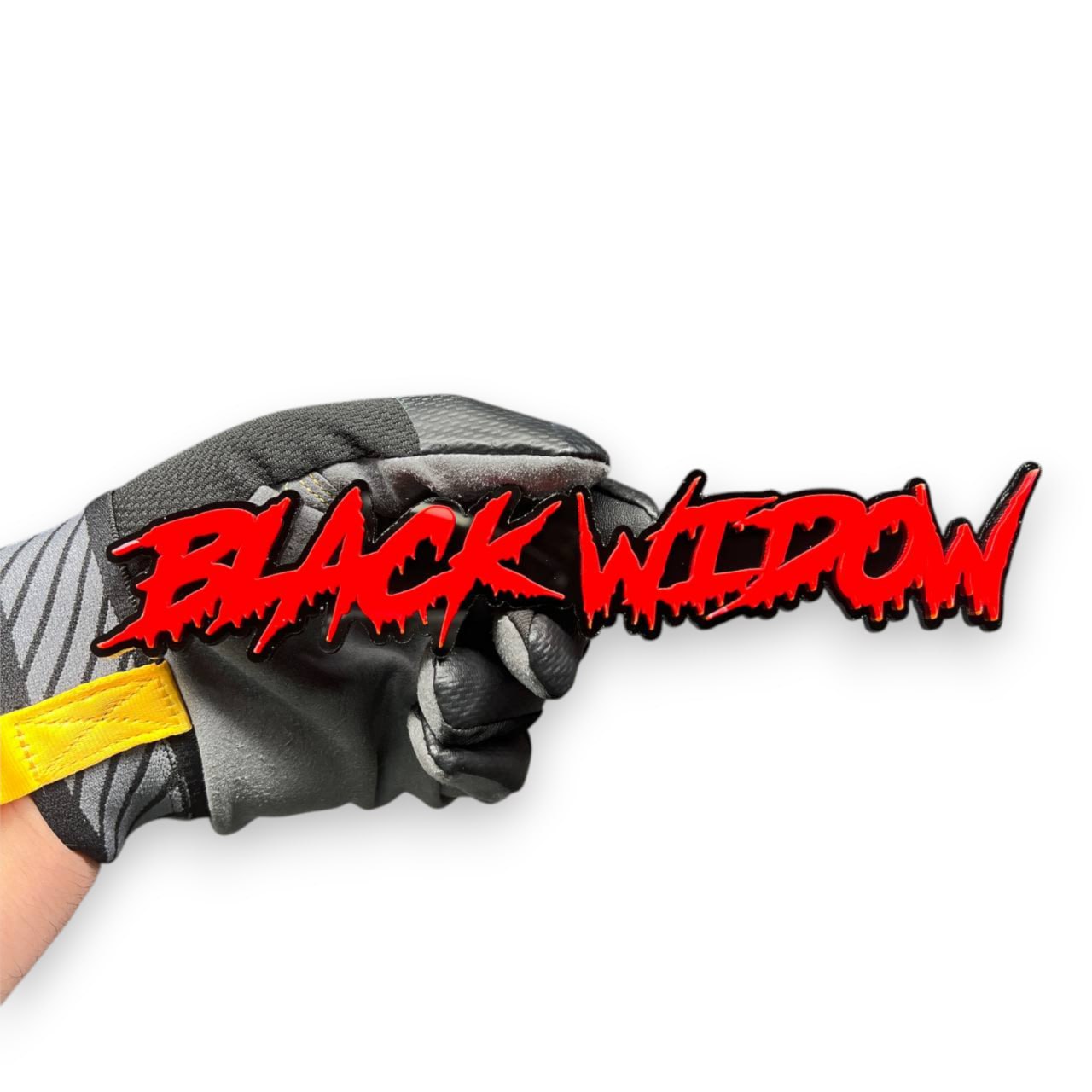 Close-up of Black Widow 3D acrylic racing emblem showing sharp drip lettering details