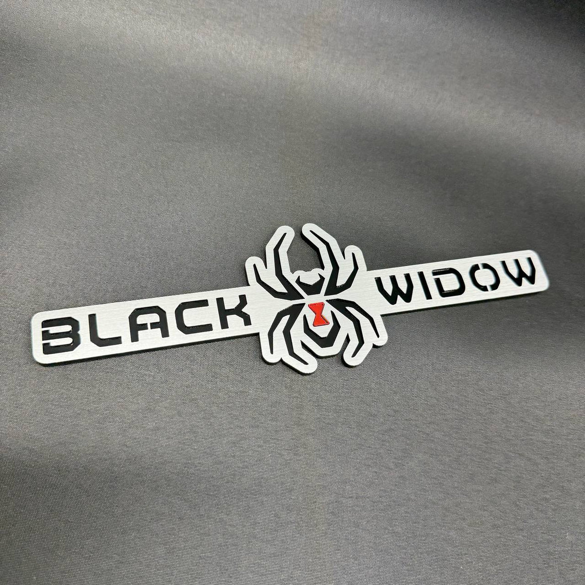 Black Widow spider emblem for Chevrolet Silverado and GMC Sierra custom automotive exterior decoration.