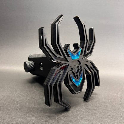 Custom black widow spider hitch cover with blue accent and black layered design