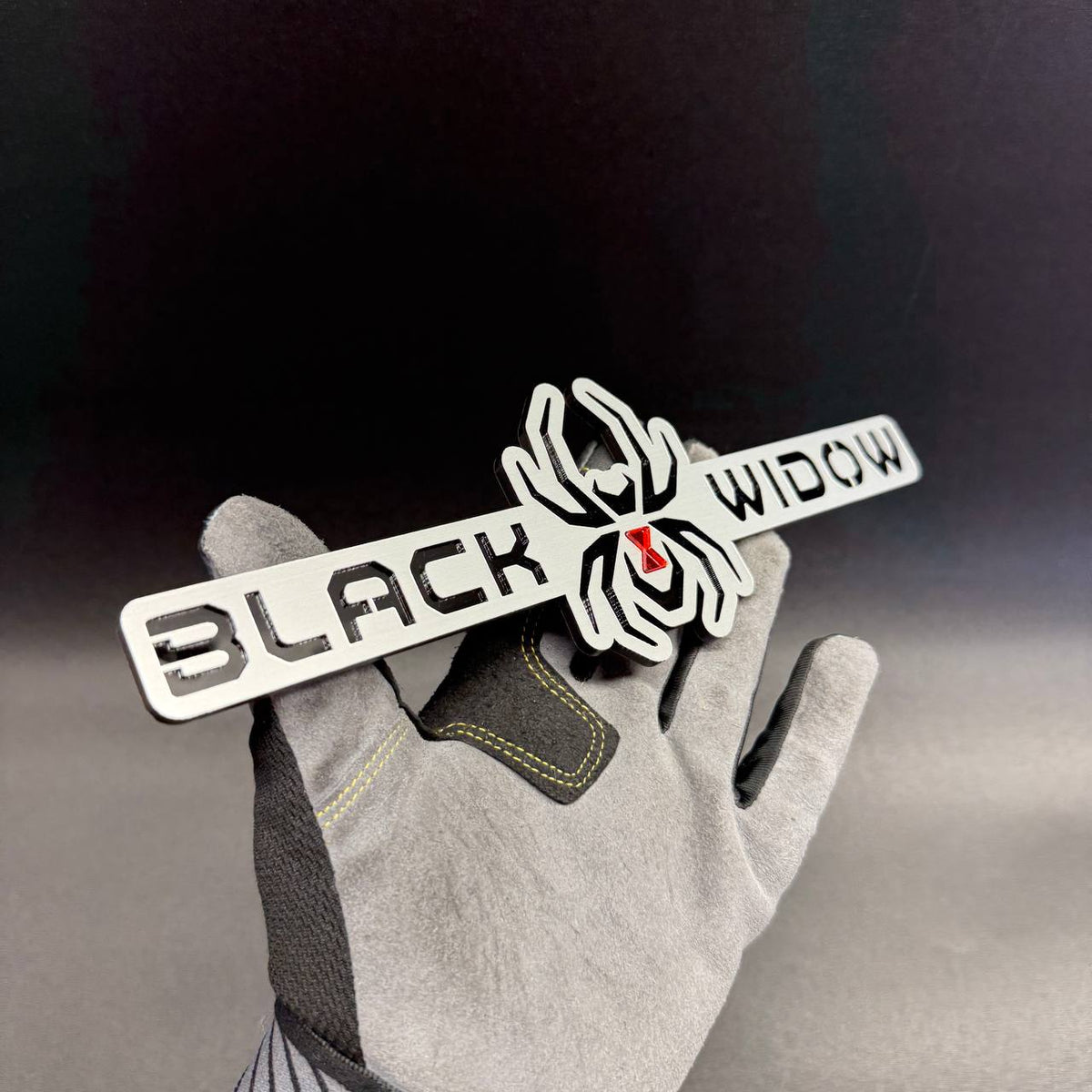 Black Widow spider automotive badge for Jeep Wrangler and Gladiator exterior styling projects.