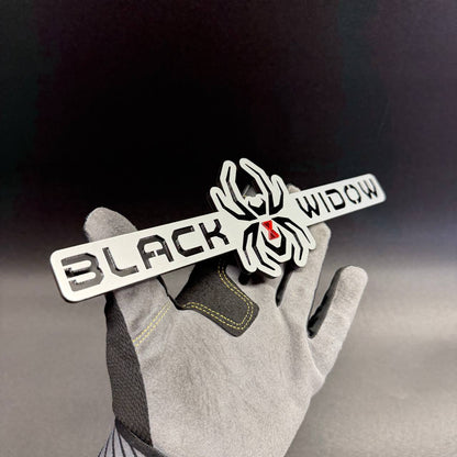 Black Widow spider automotive badge for Jeep Wrangler and Gladiator exterior styling projects.