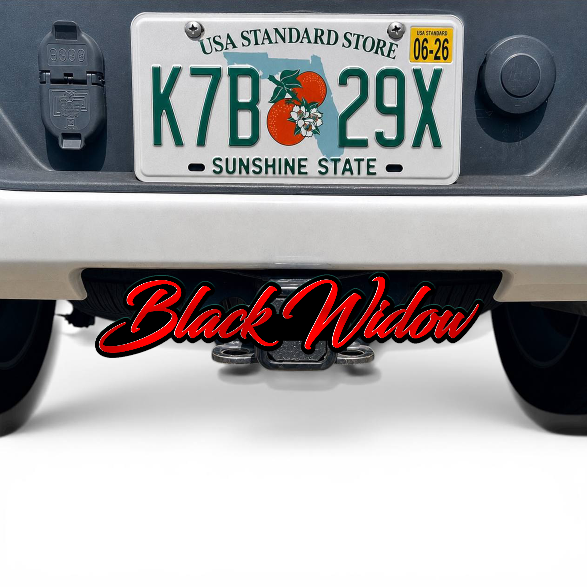 Black Widow hitch cover on pickup truck receiver with aggressive spider design for offroad and towing style