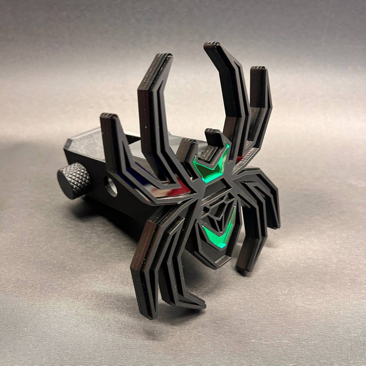 Custom spider hitch cover featuring a matte black finish and vivid green accent panels.