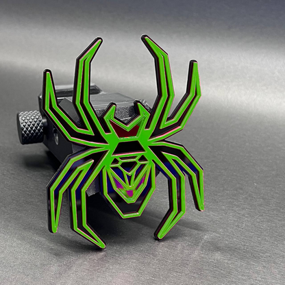 Black Widow spider hitch cover accessory for towing receivers and truck customization.