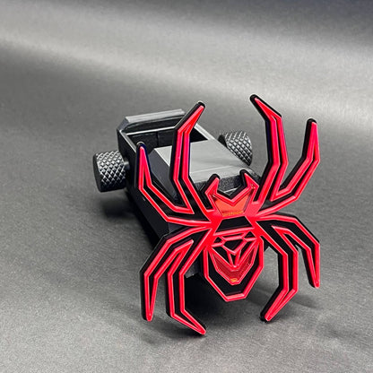 Heavy-duty Black Widow receiver hitch cover with bold mirror red spider emblem.