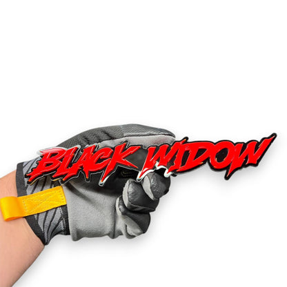 Detailed view of Black Widow custom car emblem made from layered automotive acrylic