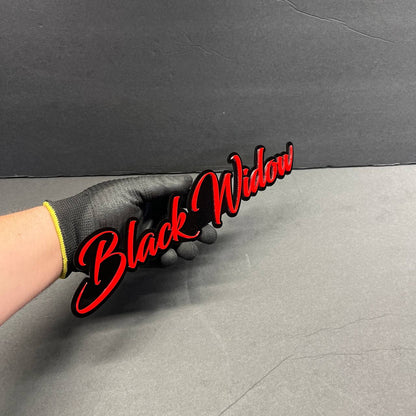 Black Widow acrylic car badge showing size and thickness, custom automotive emblem
