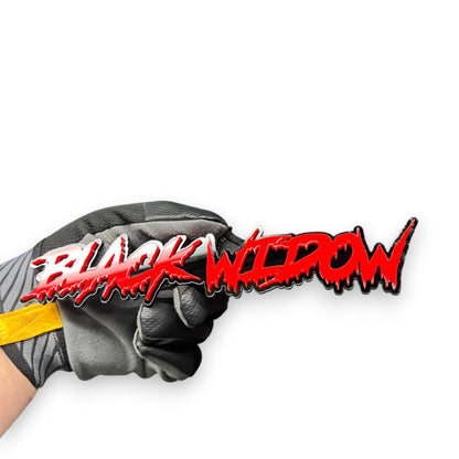 Detailed view of Black Widow custom car emblem made from layered automotive acrylic