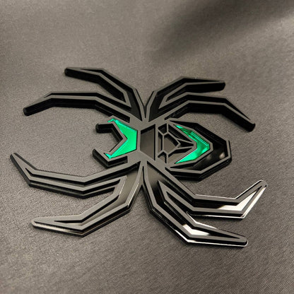 Custom Black Widow car badge style hitch cover featuring black layered legs and green accents.