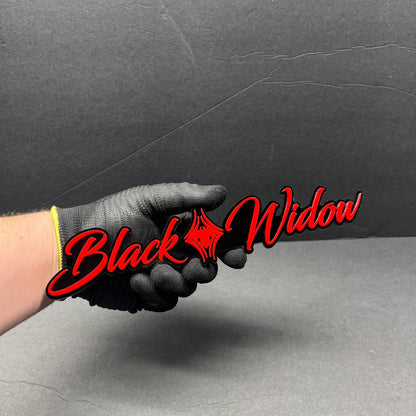 Detailed view of Black Widow custom car emblem made from layered automotive acrylic