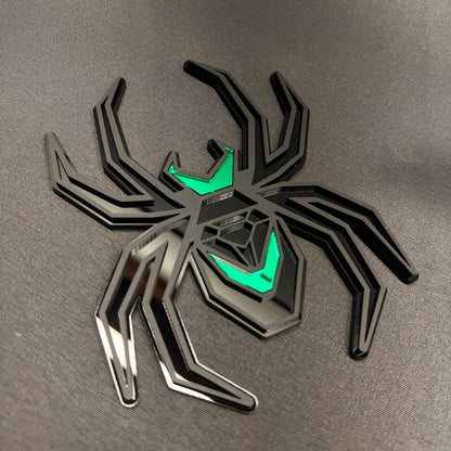 Custom Black Widow spider hitch receiver cover in matte black with bright green accents.