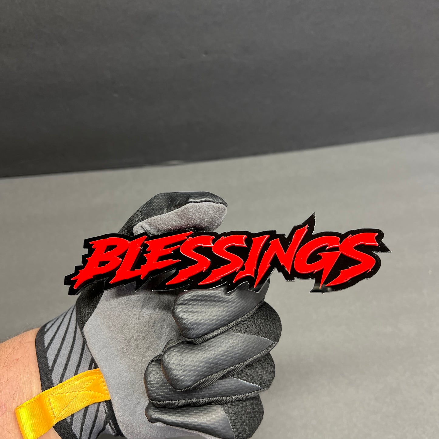 Automotive Blessings text emblem with bold red lettering and black shadow layer