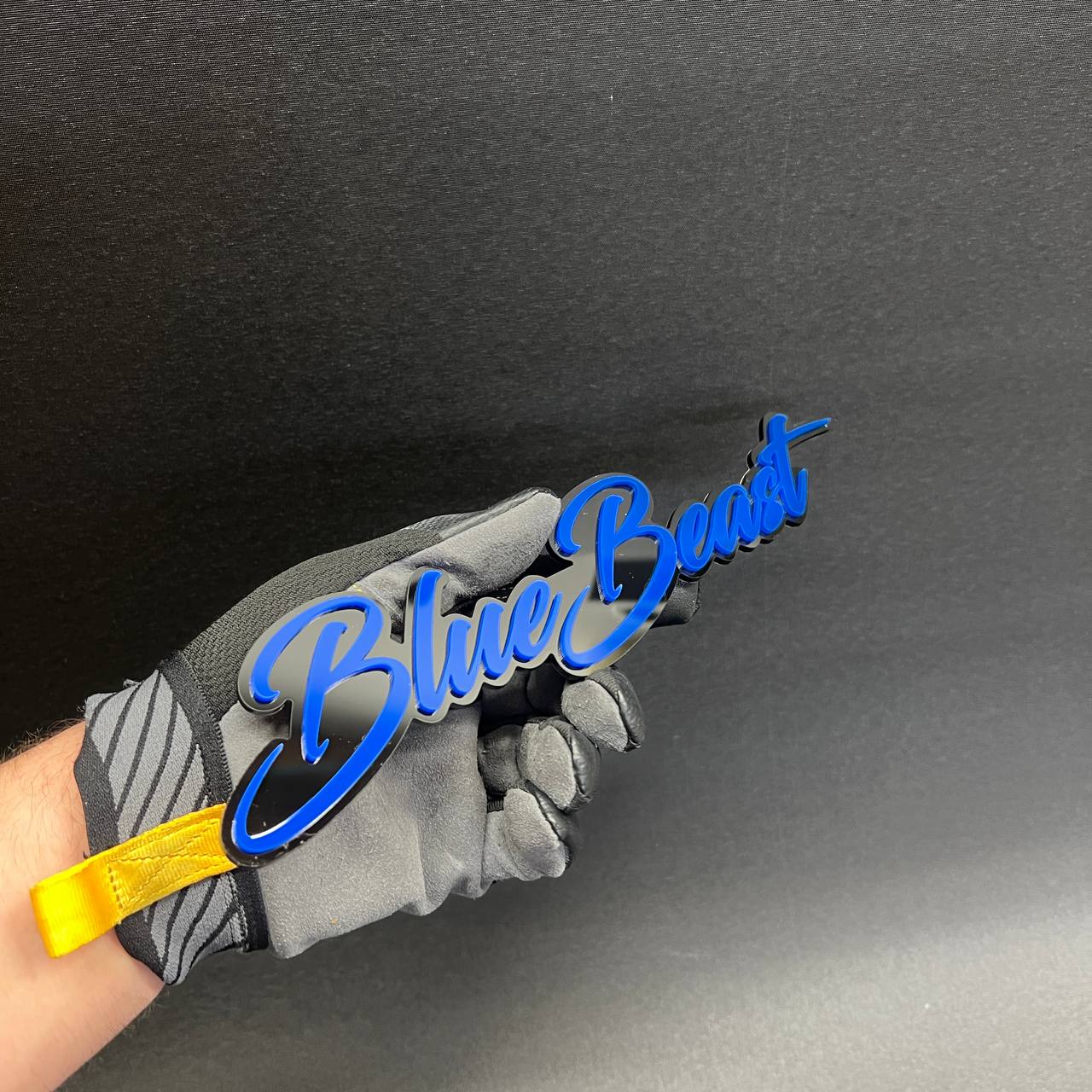 Personalized blue script auto emblem with glossy black mirror backing