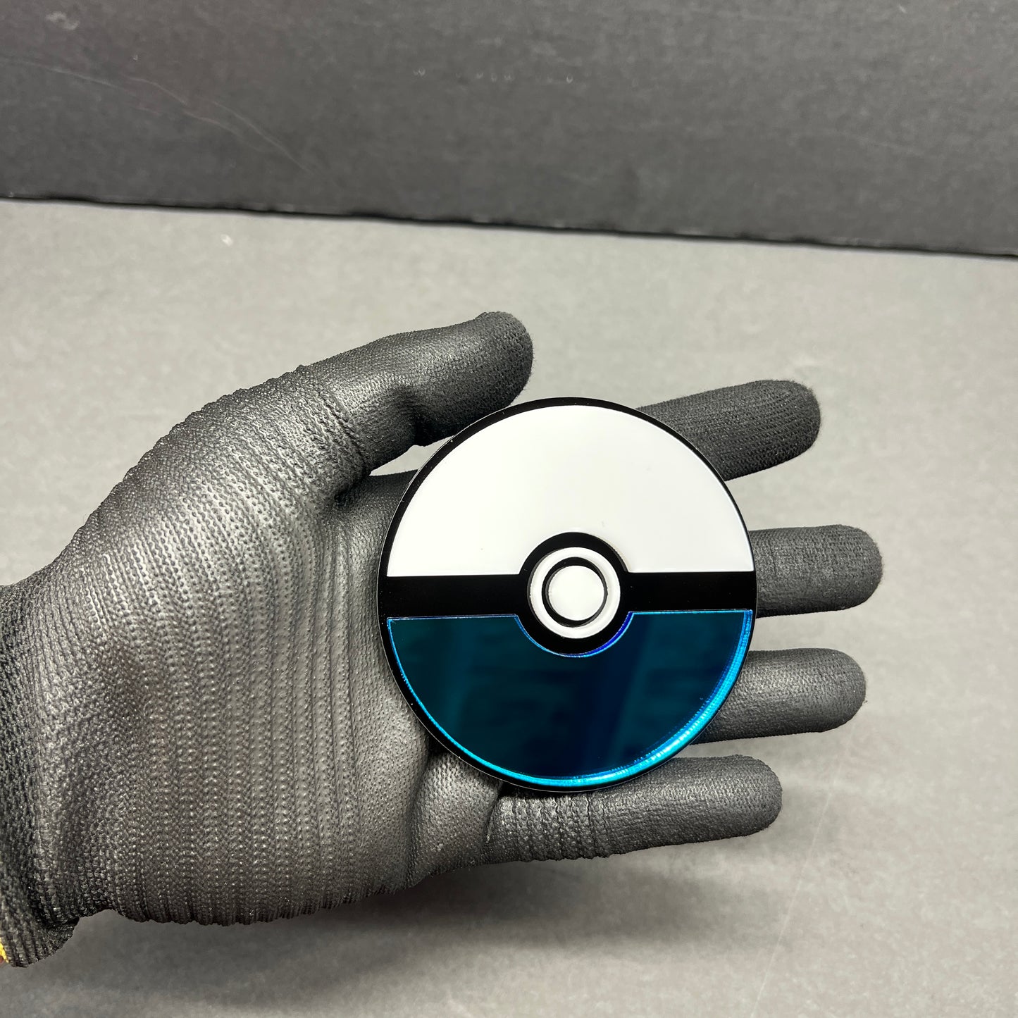 Anime inspired blue and white ball badge for car tailgate or fender