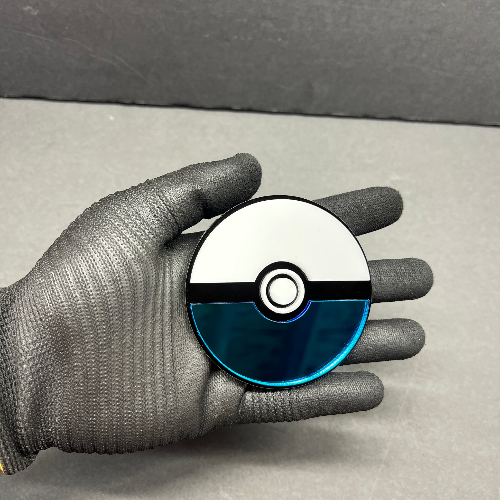 Anime inspired blue and white ball badge for car tailgate or fender