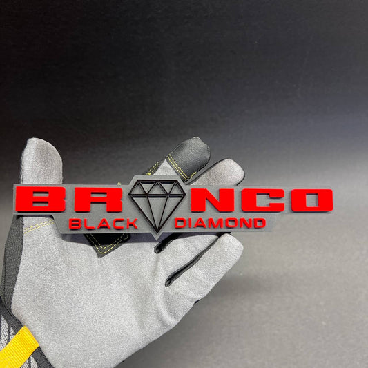 Bronco Black Diamond custom red and black car badge with 3D raised lettering.