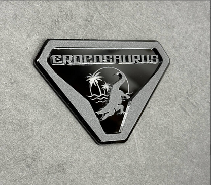 Side angle view of crocodile and alligator Crocosaurus badge on Ford Bronco off-road vehicle