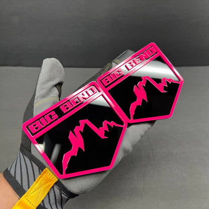 Pink and gloss black acrylic mountain badge detail with layered 3D design