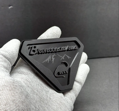 Laser-cut acrylic Broncosaurus badge designed for Ford Bronco off-road and adventure vehicles