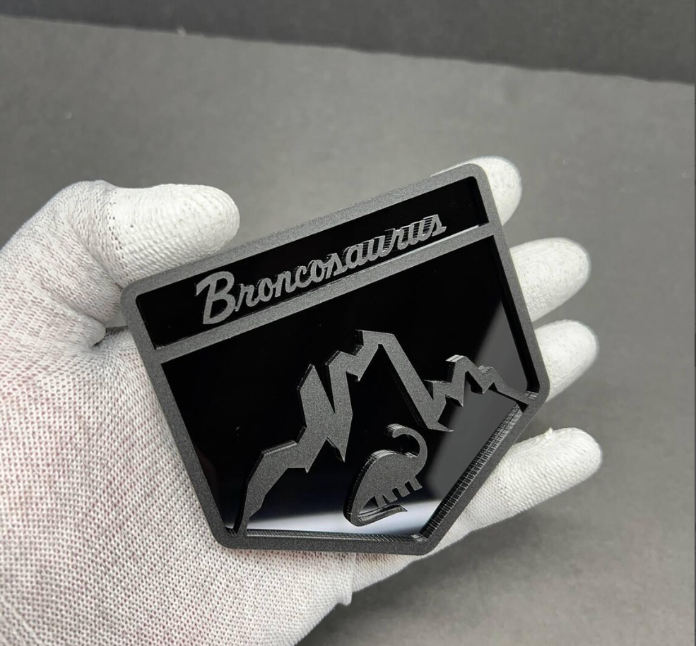 Broncosaurus emblem for Ford Bronco tailgate or grille using automotive-grade acrylic material