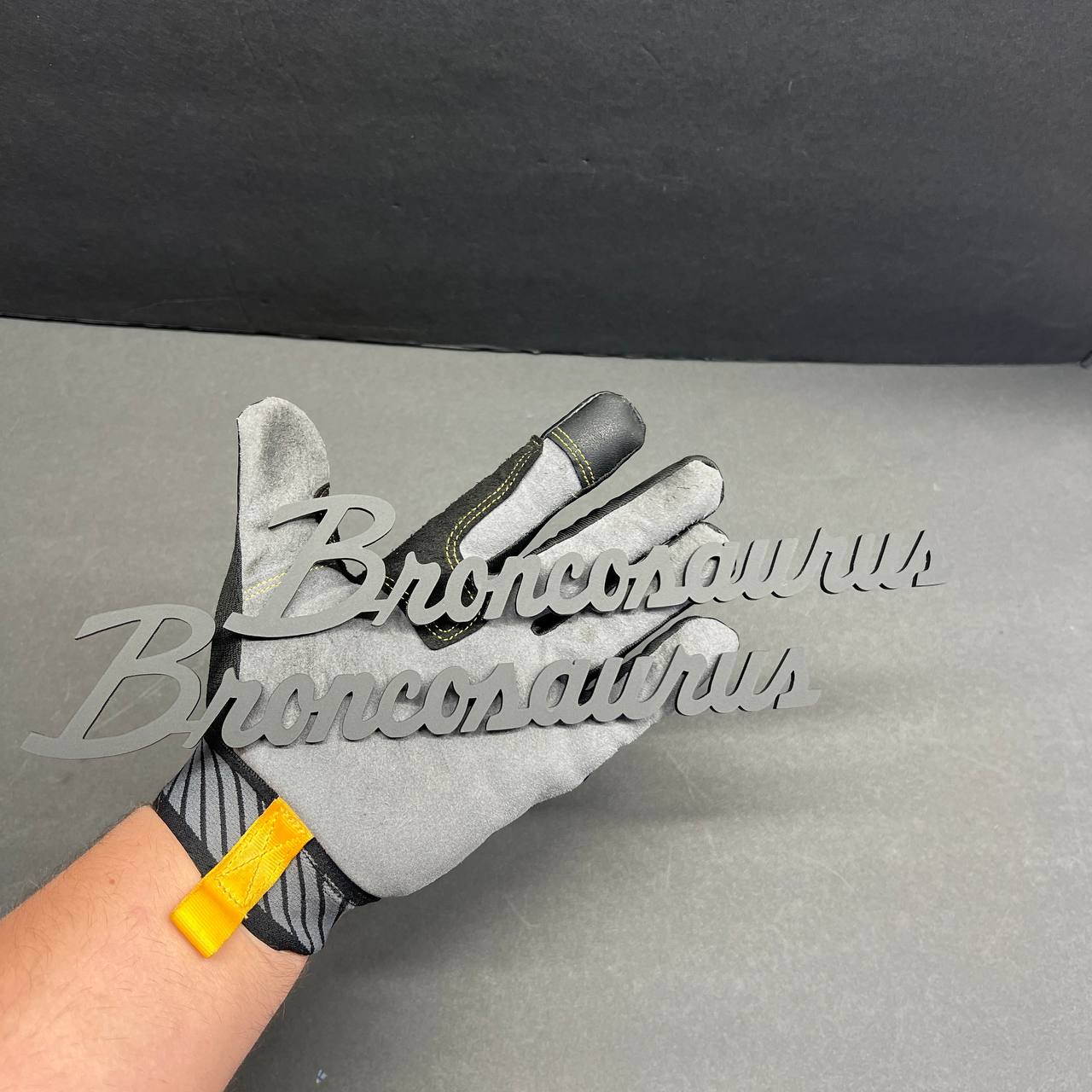 Matte black Broncosaurus exterior decal badge for cars and trucks