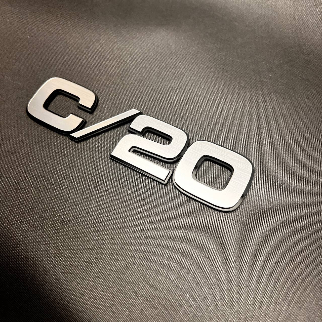 Chevy GMC C/20 truck exterior badge with brushed silver billet front finish