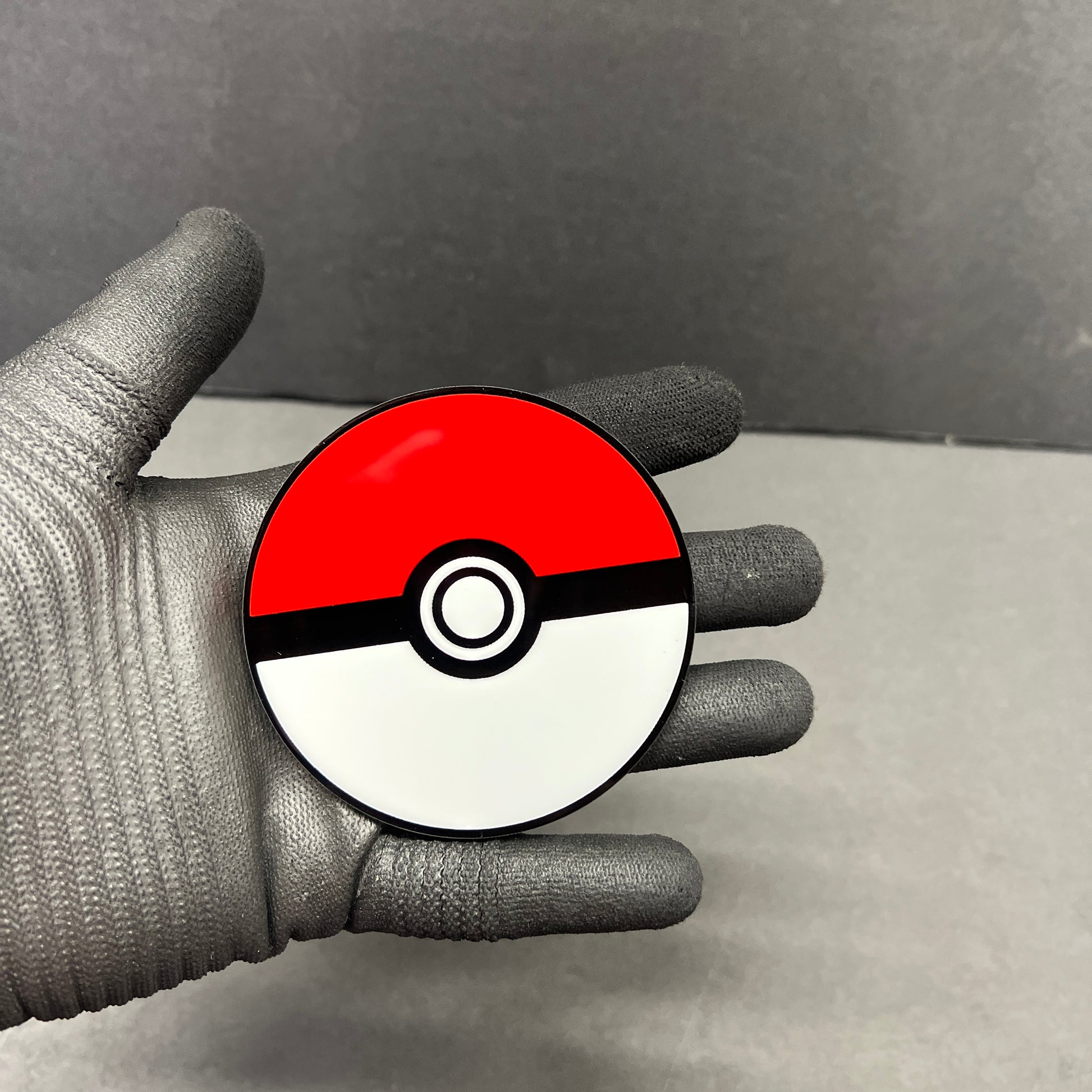 Red white and black 3D layered car badge with clean glossy finish