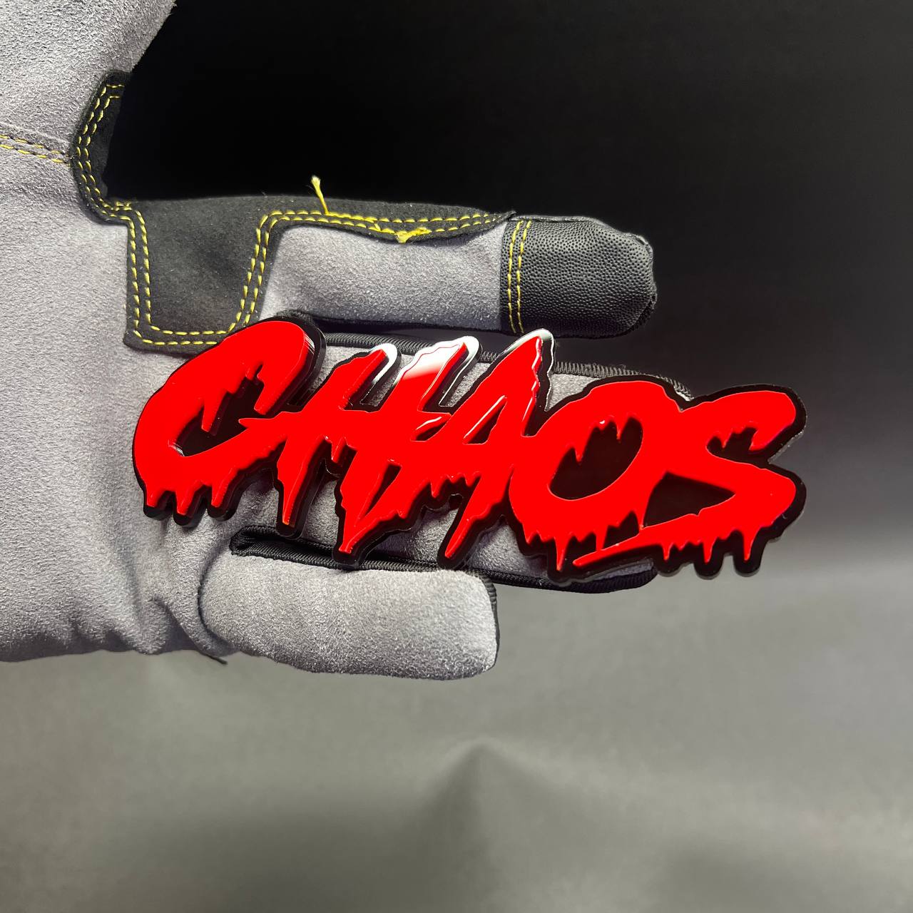 Red and black CHAOS hood truck decal with aggressive custom text badge design for RAM 1500.
