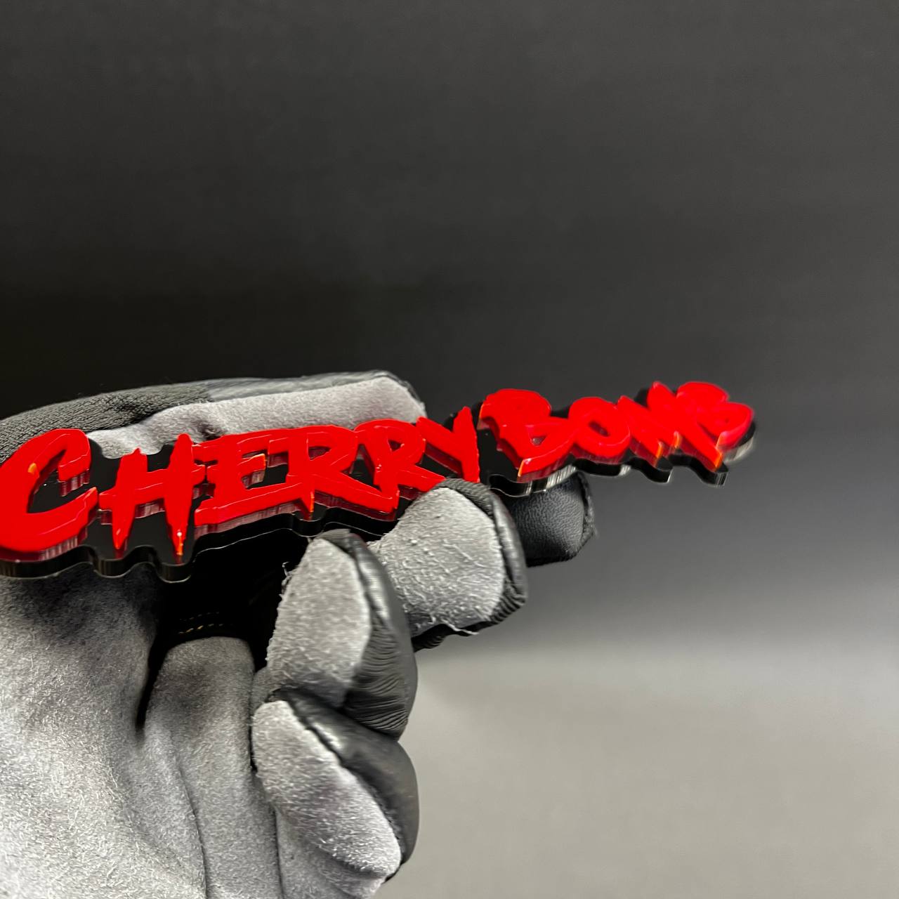 Red Cherry Bomb custom text emblem with aggressive dripping font