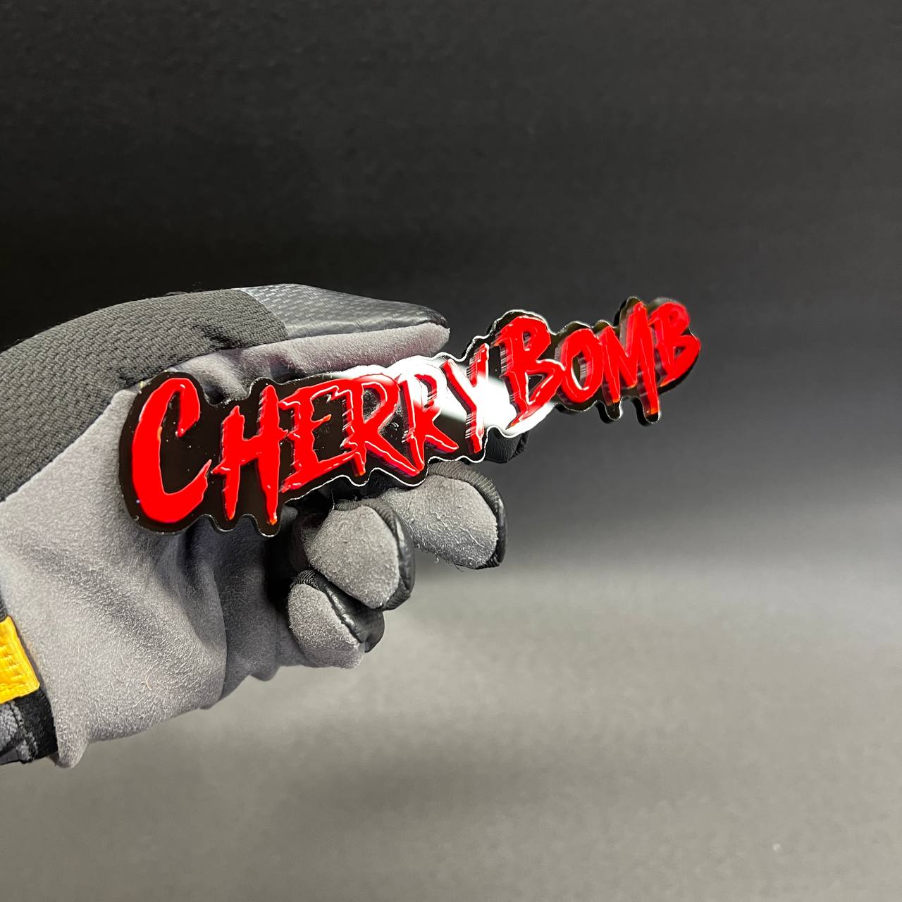Custom Cherry Bomb JDM style car badge with black outline acrylic