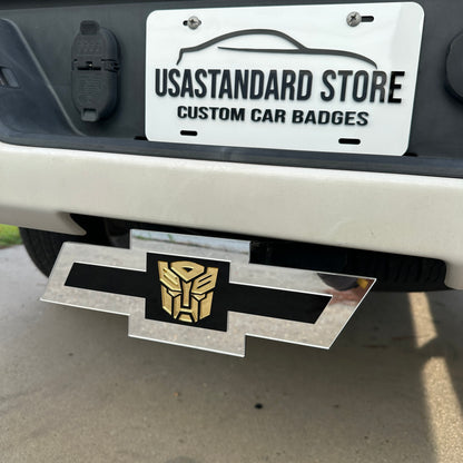 Chevrolet Bowtie hitch cover with silver finish and gold Autobot logo center