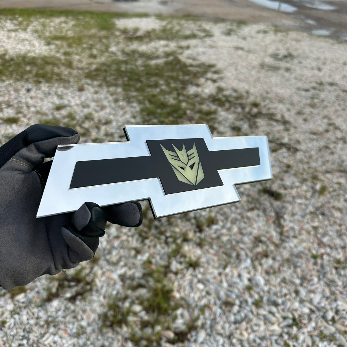 Chevrolet Bowtie automotive emblem with Decepticon symbol and silver border