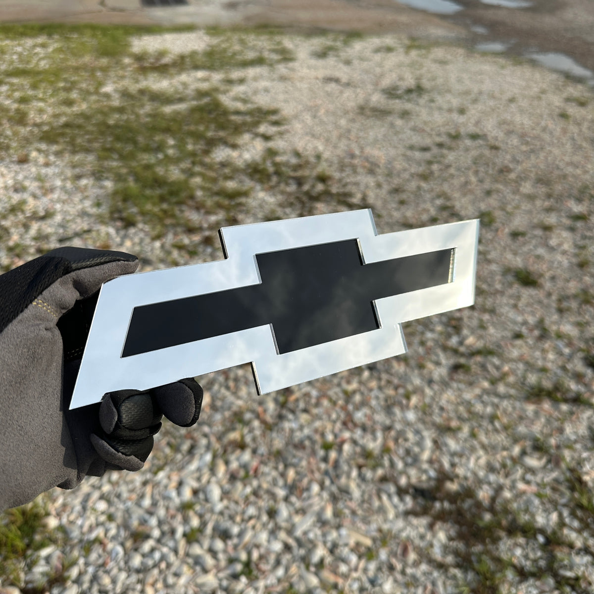 Chevy Bowtie automotive emblem in layered silver and black design